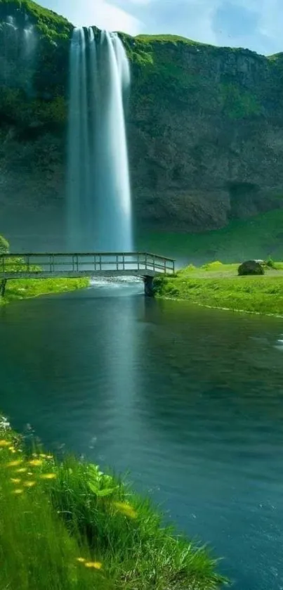 Waterfall cascading into a river surrounded by greenery and a bridge.