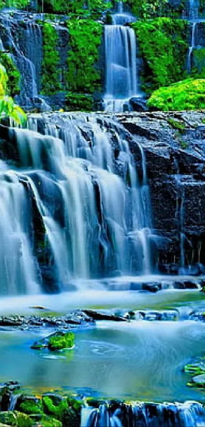 Vibrant waterfall with lush greenery wallpaper.