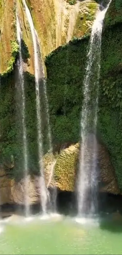 Cascading waterfall over lush green cliffs in vibrant nature setting.