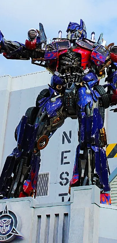Transforming robot statue on building rooftop.