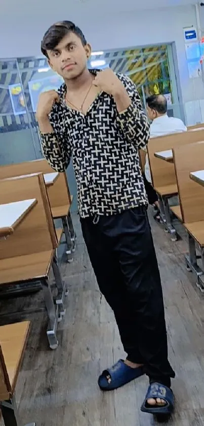 Young adult in trendy cafe with casual attire.