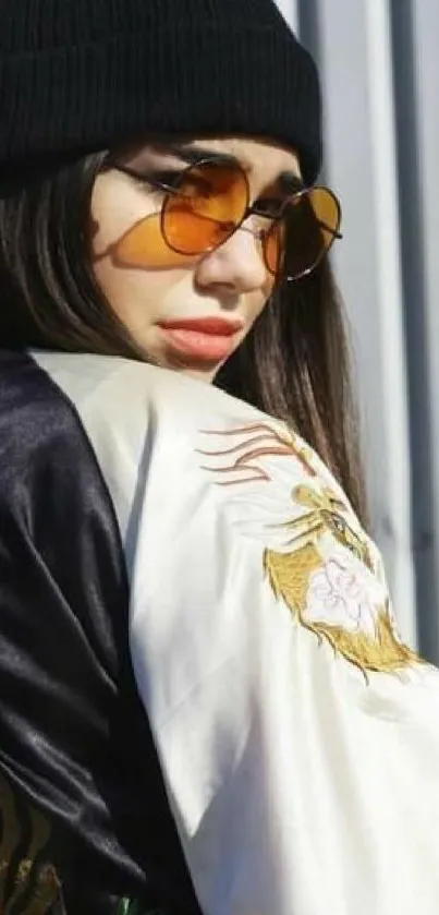 Chic fashion wallpaper with sunglasses and stylish jacket.