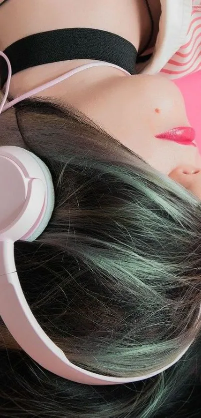 Woman wearing headphones on a pink background.