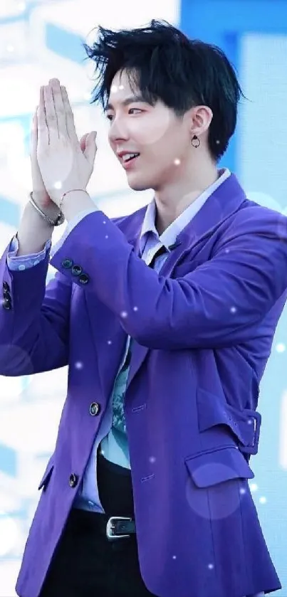 Person wearing a purple jacket at an event.