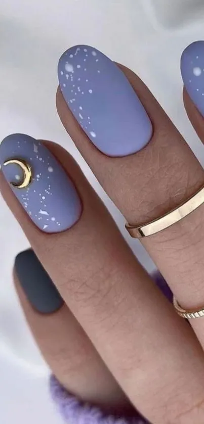 Lavender nails with crescent moon design and gold accents.