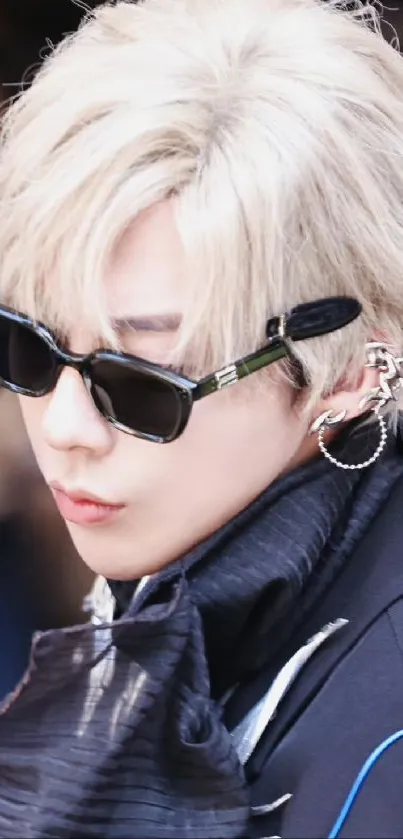 Blonde individual wearing trendy sunglasses with stylish fashion.