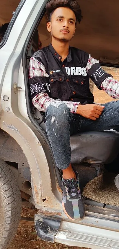 Young man in a car with urban fashion.