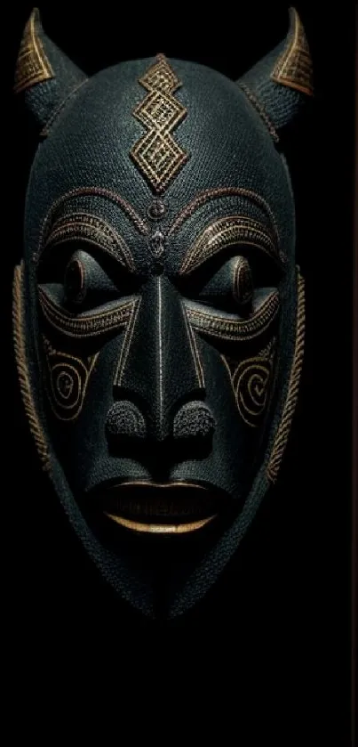 Intricate tribal mask design on black background.