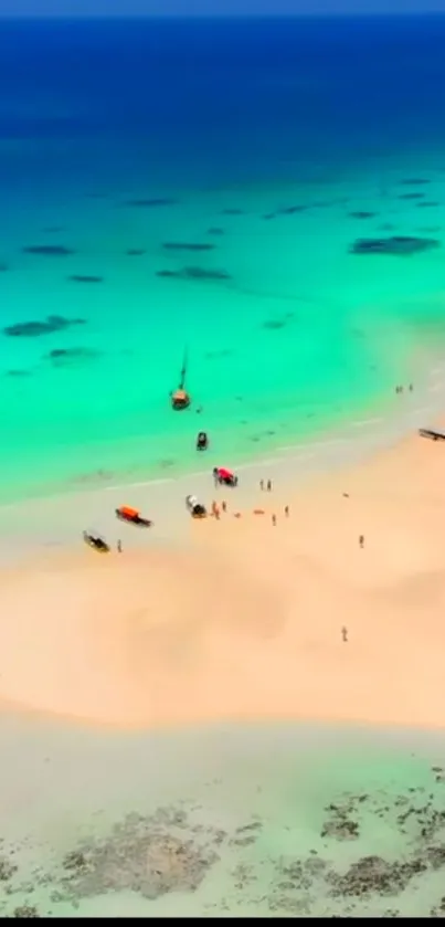 Aerial view of a tropical beach with turquoise waters and sandy shores.