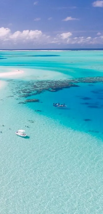 Aerial view of a tropical beach with turquoise waters and white sand.