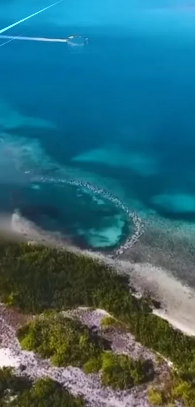 Aerial view of a tropical island with teal waters and lush green coastlines.