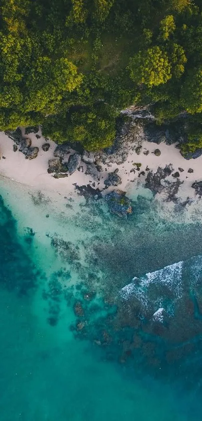 Aerial view of a tropical beach with emerald waters and lush greenery.