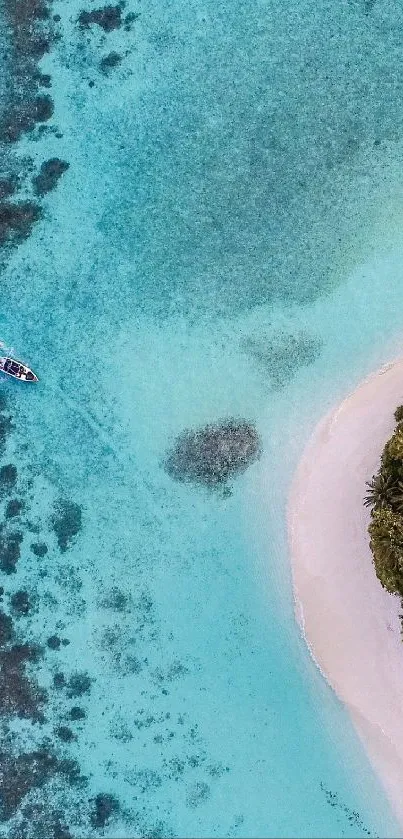 Aerial view of turquoise water and tropical beach with lush greenery.