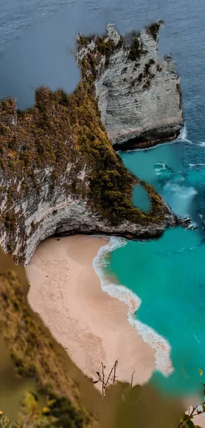 Aerial view of a tropical beach with turquoise water and dramatic cliffs.