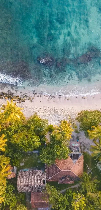 Aerial view of a tropical beach with turquoise water and lush greenery.