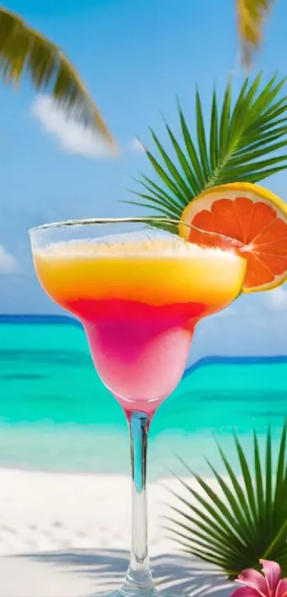 Vibrant cocktail on a sunny tropical beach with palm leaves and ocean.