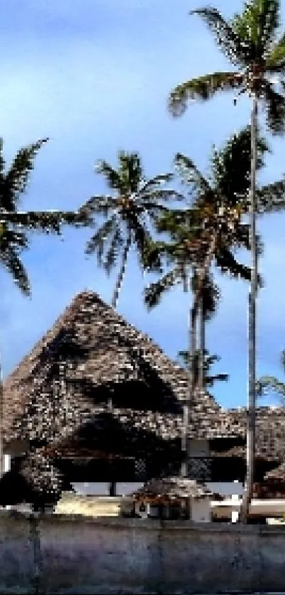 Tropical beach cottage surrounded by palm trees.
