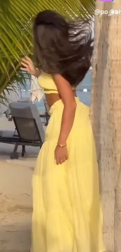 Woman in a yellow dress on a tropical beach with palm trees.