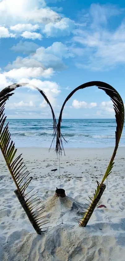 Heart-shaped palm leaves on tropical beach.