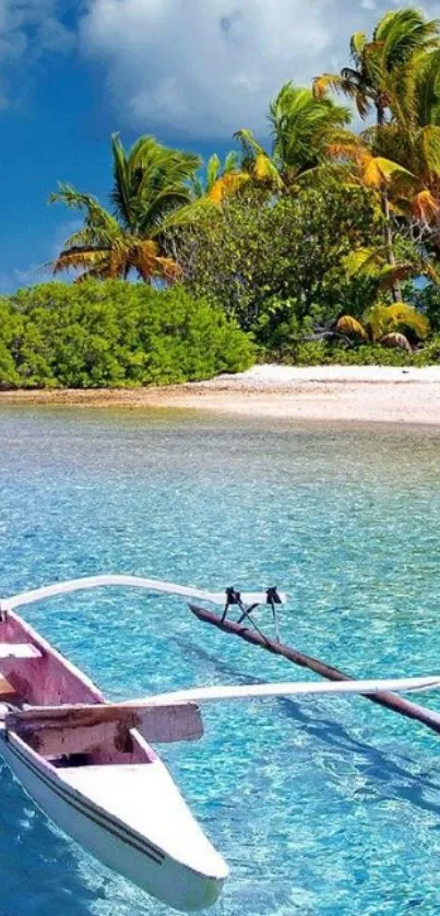 Tropical beach with clear water and a wooden canoe in the foreground.