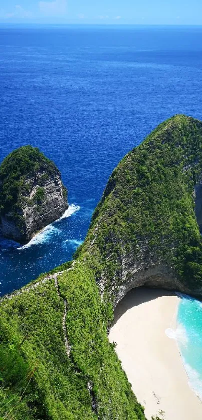 Aerial view of a tropical beach with blue water and lush green cliffs