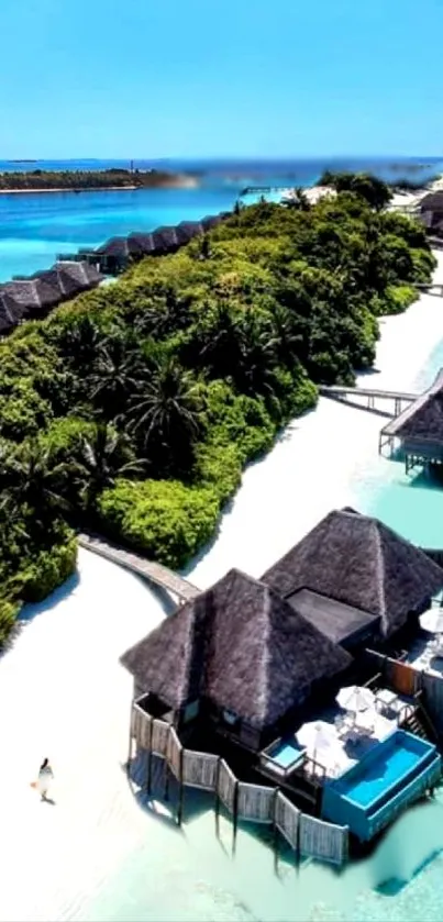 Aerial view of tropical beach with overwater bungalows and lush greenery.