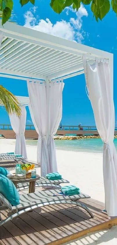 Tropical beach with pergola and blue sky.