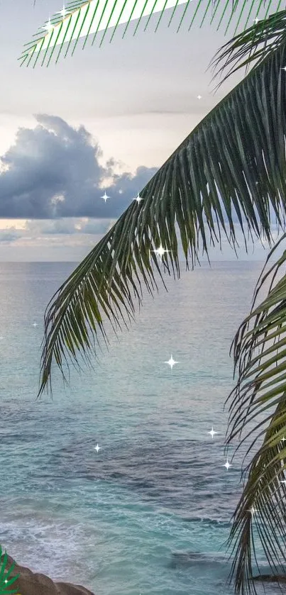 Tropical beach with palm leaves and tranquil ocean view at sunset.