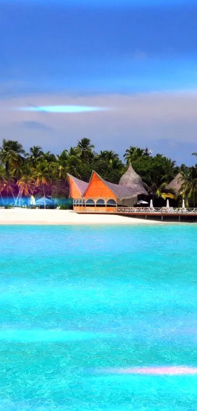 Tropical island with turquoise water and palm trees under blue sky.