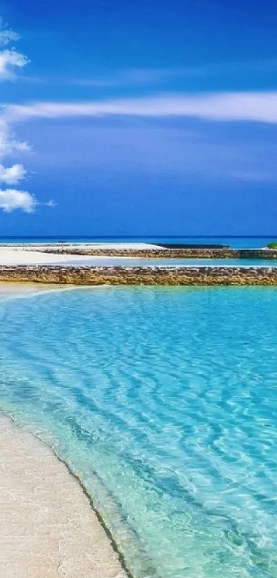 Tropical beach wallpaper with blue waters and sandy shore.