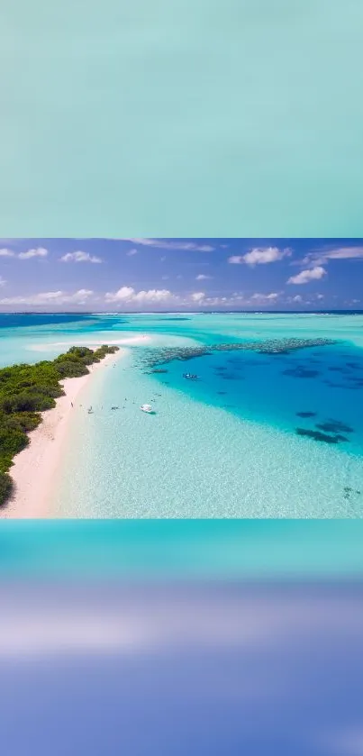 Aerial view of tropical beach with clear blue water and white sandy shore.