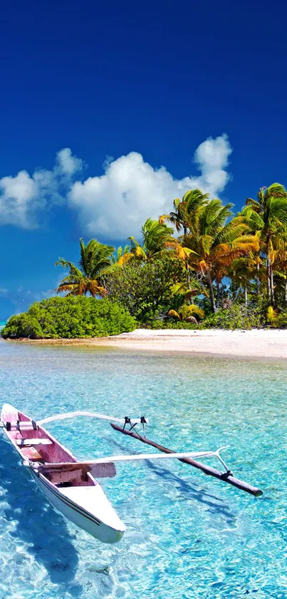 A boat floating on crystal-clear tropical waters near a lush island.