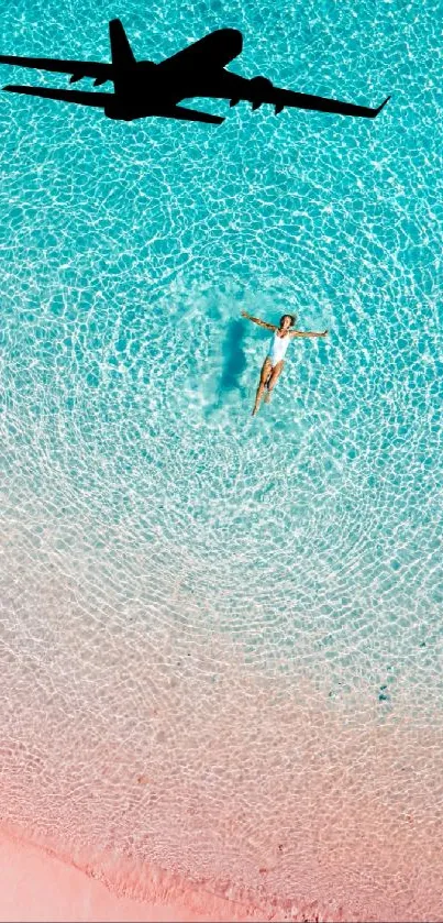 Turquoise beach with plane above and swimmer below.