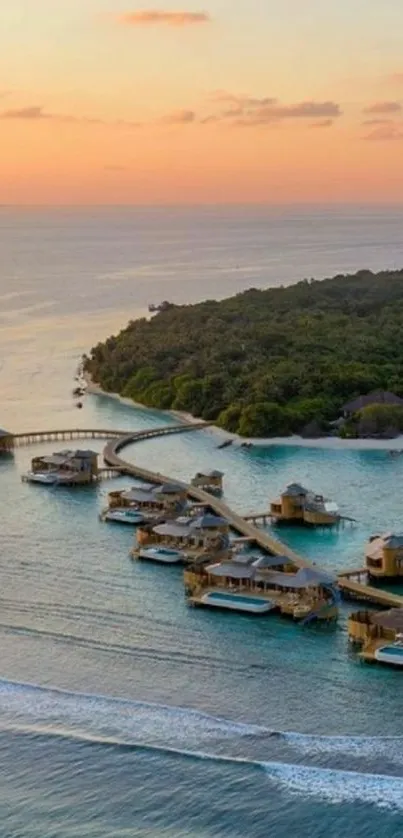 Tropical island resort with sunset over blue ocean.