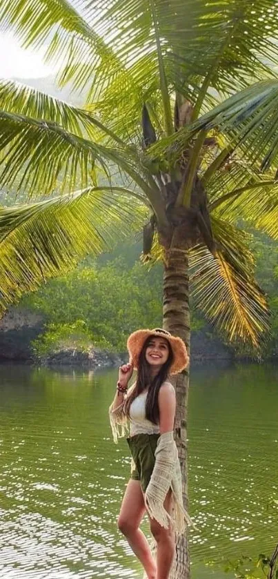 Woman in scenic tropical setting with palm tree and river.