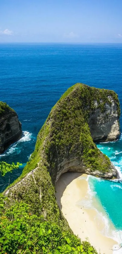 Tropical beach with dramatic cliffs and vibrant blue ocean water.