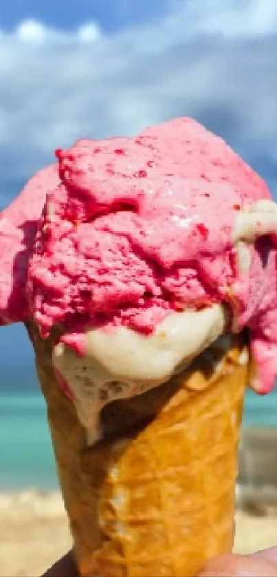 Pink ice cream cone on a tropical beach background.