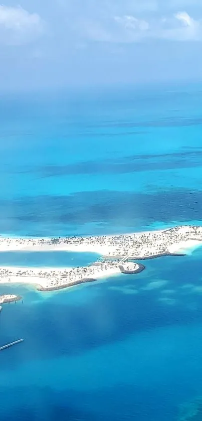 Aerial view of tropical island with bright turquoise ocean.