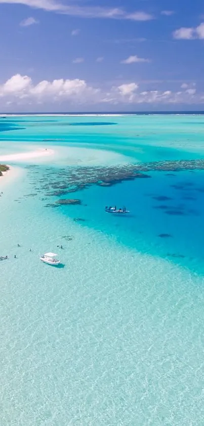 Tropical beach with turquoise waters and a clear blue sky.