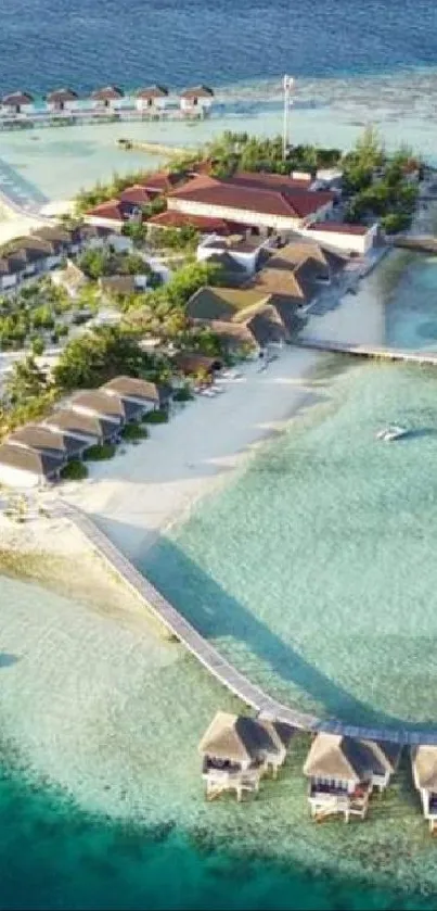 Aerial view of tropical island with overwater bungalows and blue ocean.