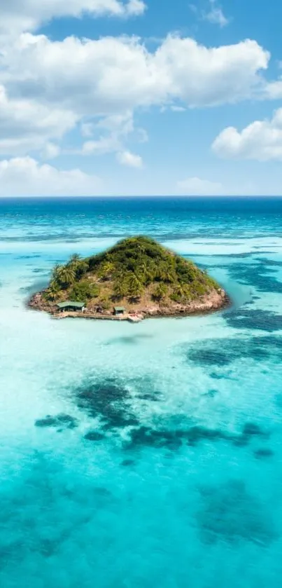 Tropical island surrounded by turquoise sea and blue sky.