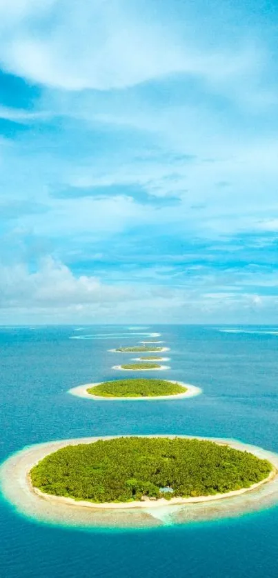 Aerial view of tropical islands with clear blue water under a vibrant cyan sky.