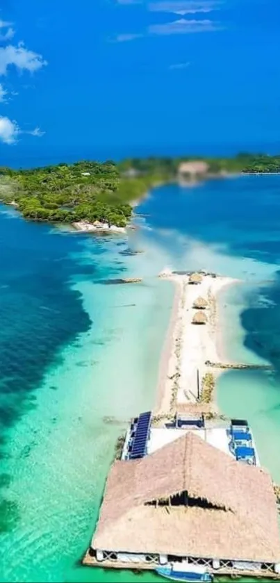 Tropical island with turquoise waters and sandy path extending into the ocean.