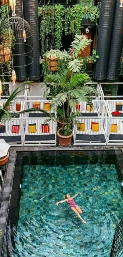 Woman floating in a tropical green pool surrounded by plants.