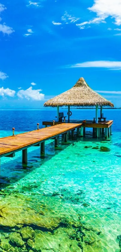 Tropical ocean pier with thatched hut and turquoise waters.