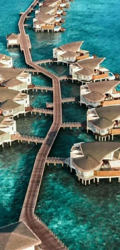 Aerial view of luxurious overwater bungalows on turquoise ocean.