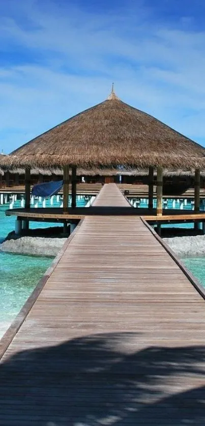 Overwater bungalow with turquoise waters and a clear blue sky.