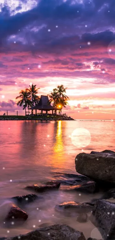 Tropical sunset with palm trees by a rocky beach, under a purple sky.