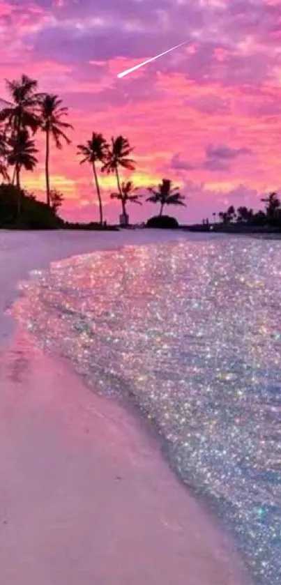 A tropical sunset beach with a vibrant pink sky and shimmering water.