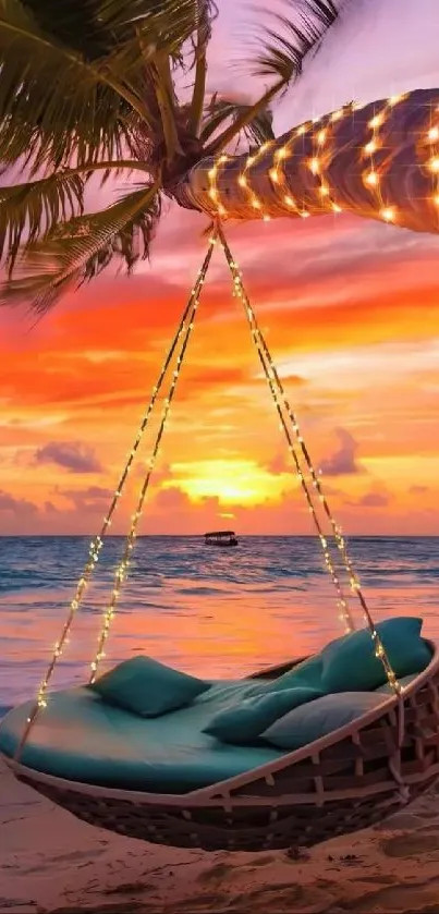 Hammock on a tropical beach with a stunning sunset background.